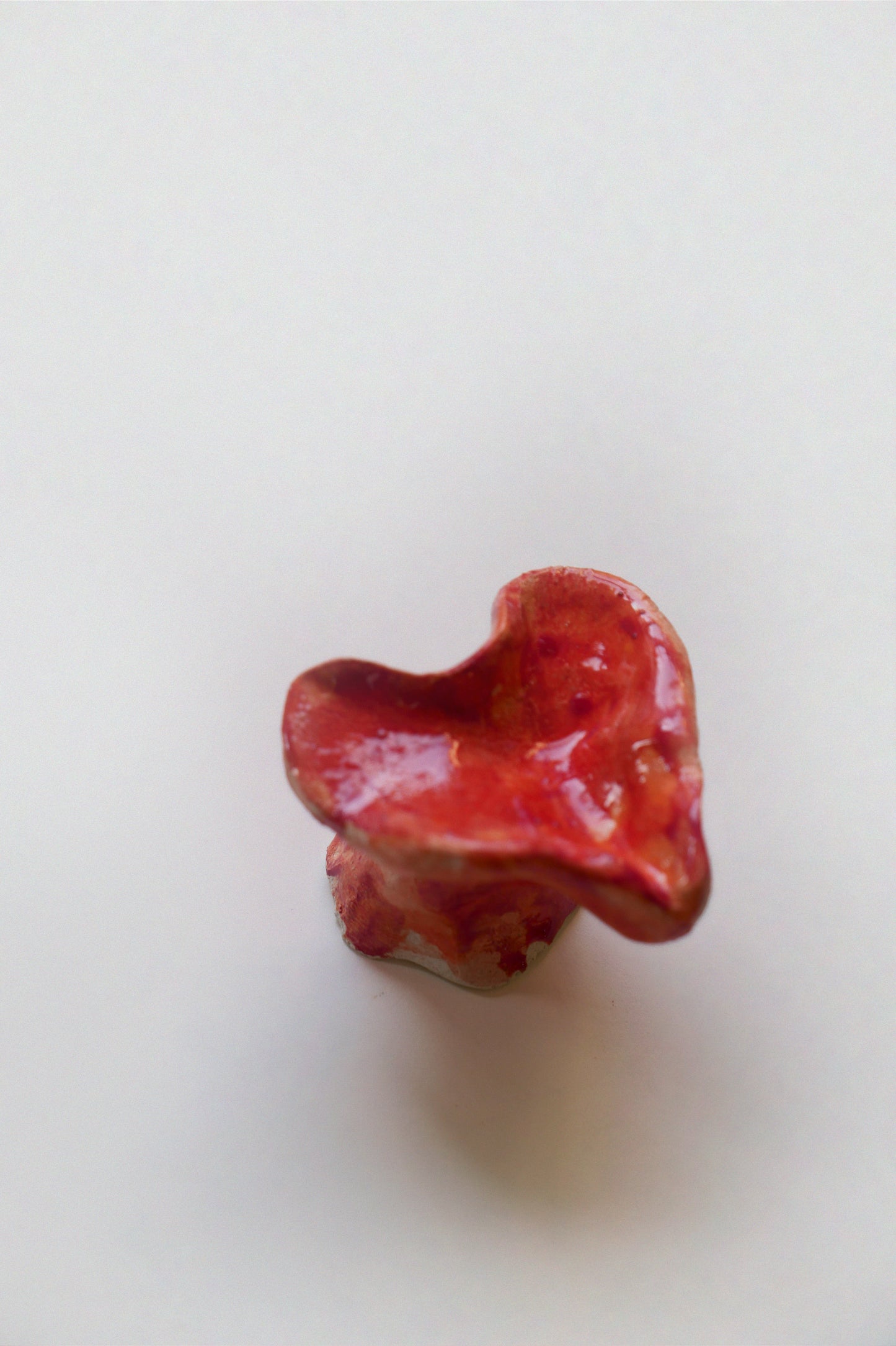 Ceramic knob, orange red heart