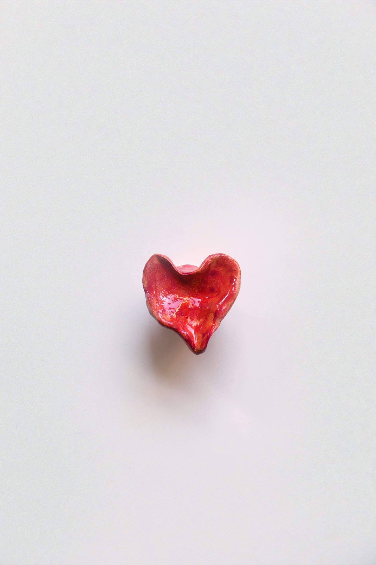 Ceramic knob, orange red heart